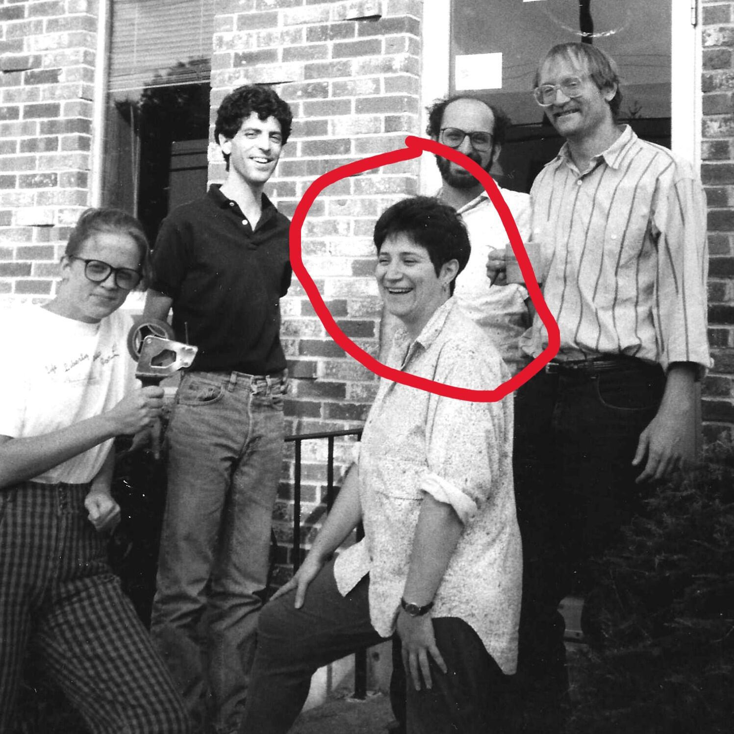 Early photo of Equal Exchange founders and staff Myrna Greenfield, employee #1 at Equal Exchange, with the three founders and employee Susan Oppie, stand in front of their former warehouse in Stoughton, Mass.