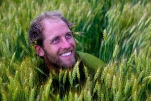 Photo of Rob Greenfield in a field